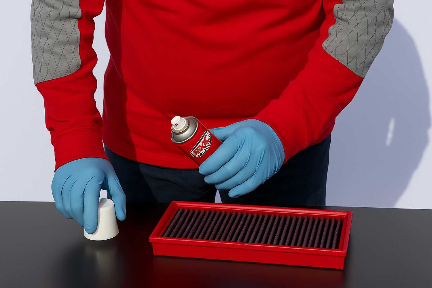 BMC air filter being cleaned with the official washing kit, showing step-by-step maintenance process for reusable performance filters.