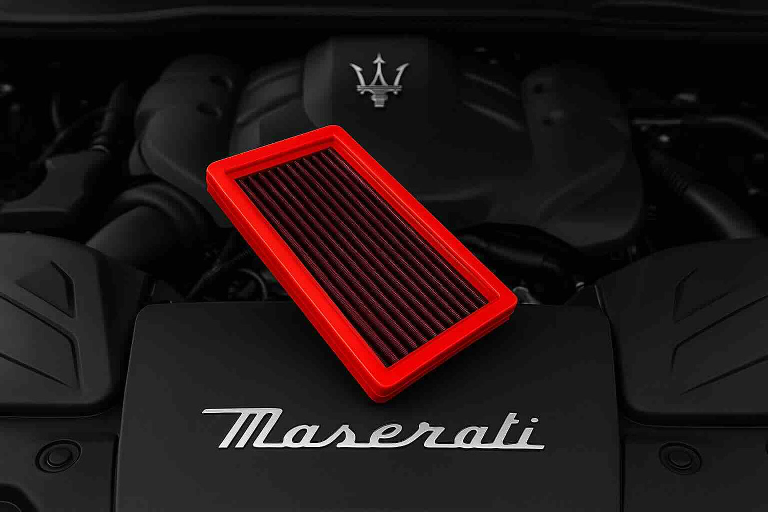Red BMC FB01195 performance air filter in front of a Maserati GranTurismo Modena and Trofeo, highlighting improved airflow, filtration, and racing heritage.